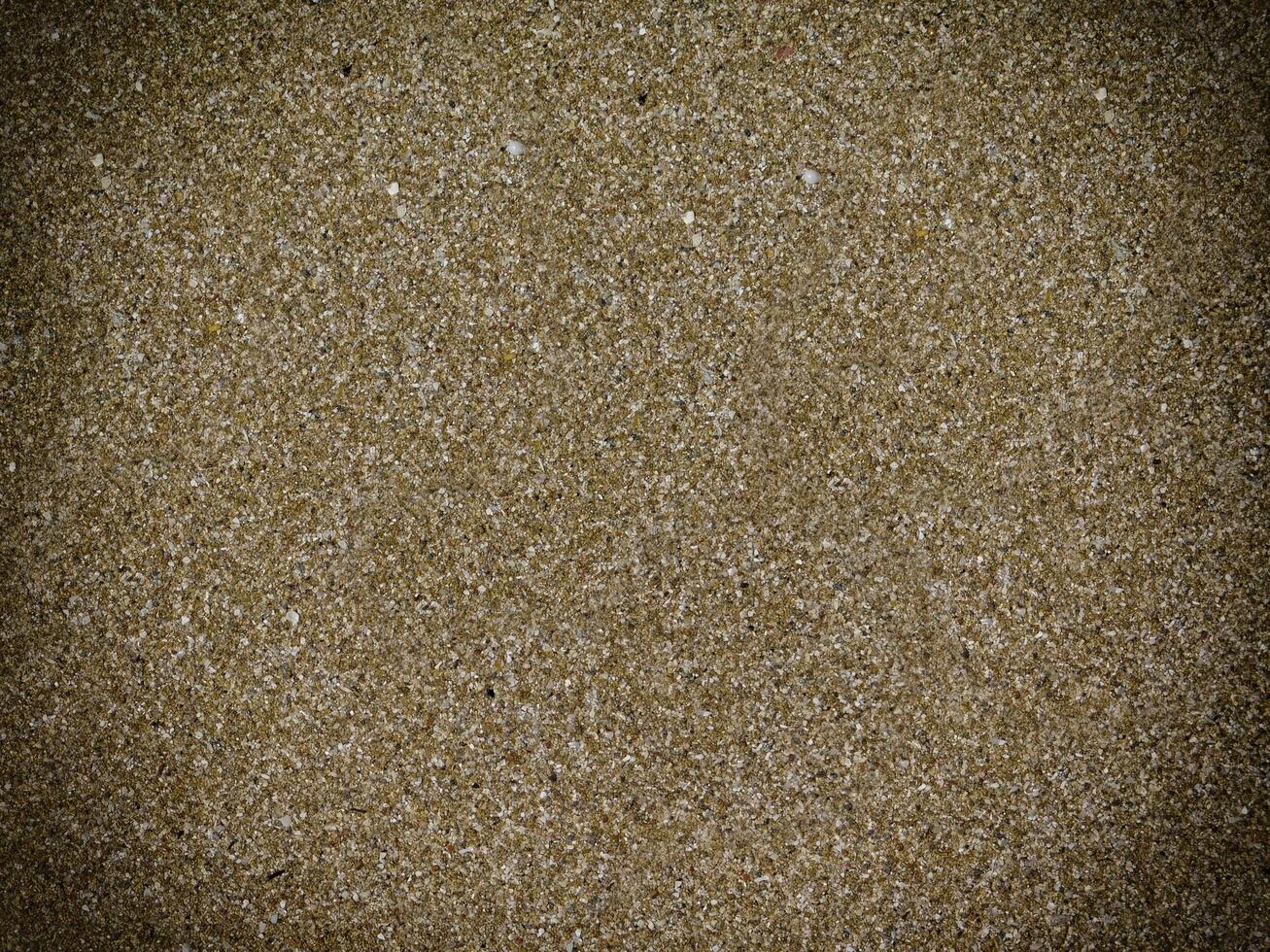 Texture Of Dark Sand At The Sea photo