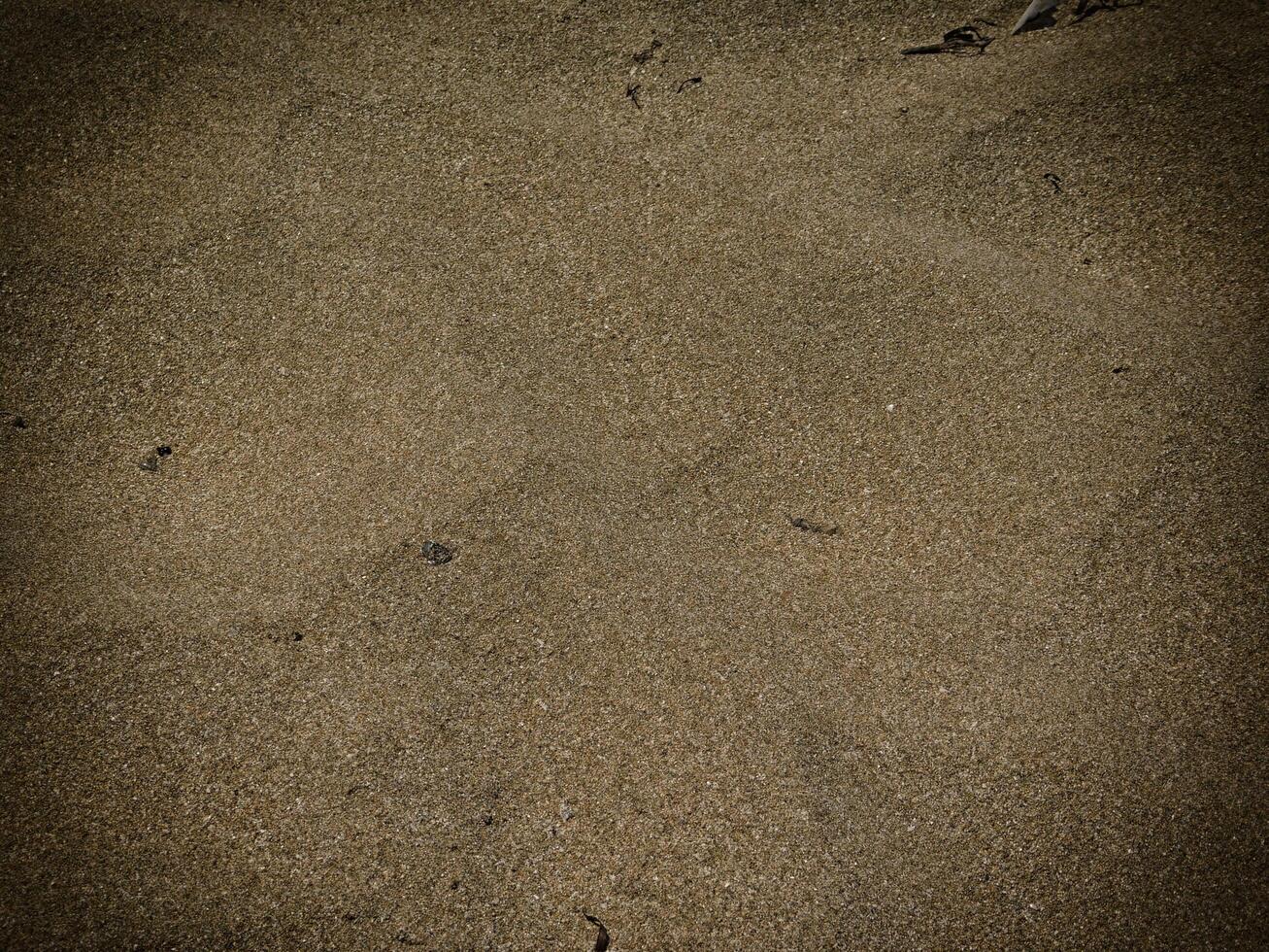 Texture Of Dark Sand At The Sea photo