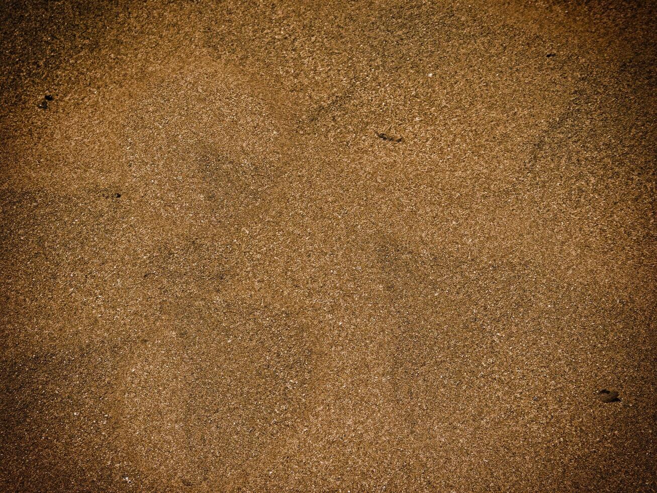 Texture Of Dark Sand At The Sea photo