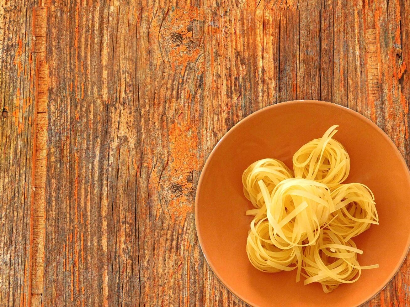 Pasta On Wooden Background photo