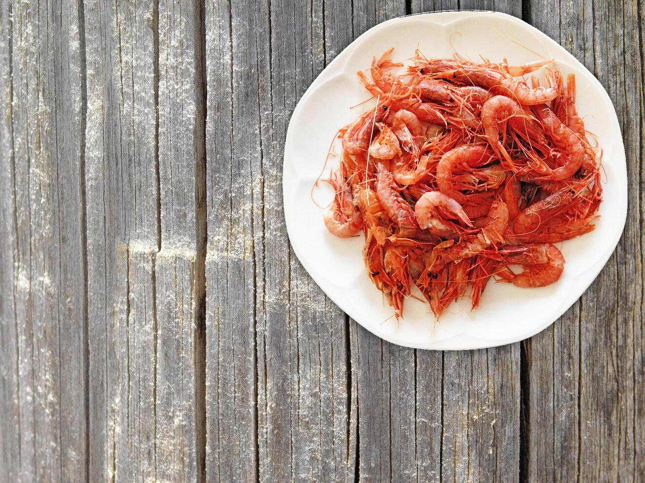 Shrimp On Wooden Background photo
