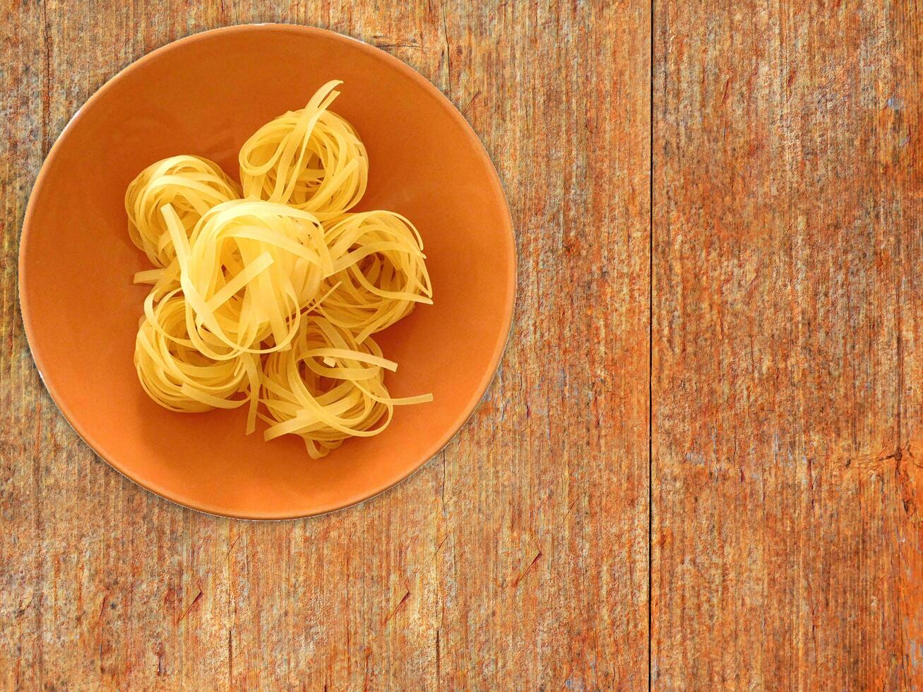 Pasta On Wooden Background photo