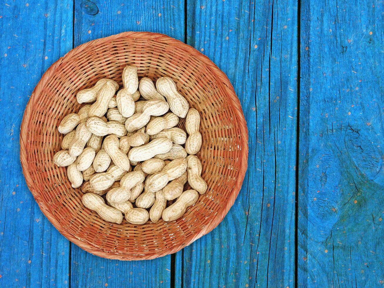 Peanuts On The Wooden Background photo