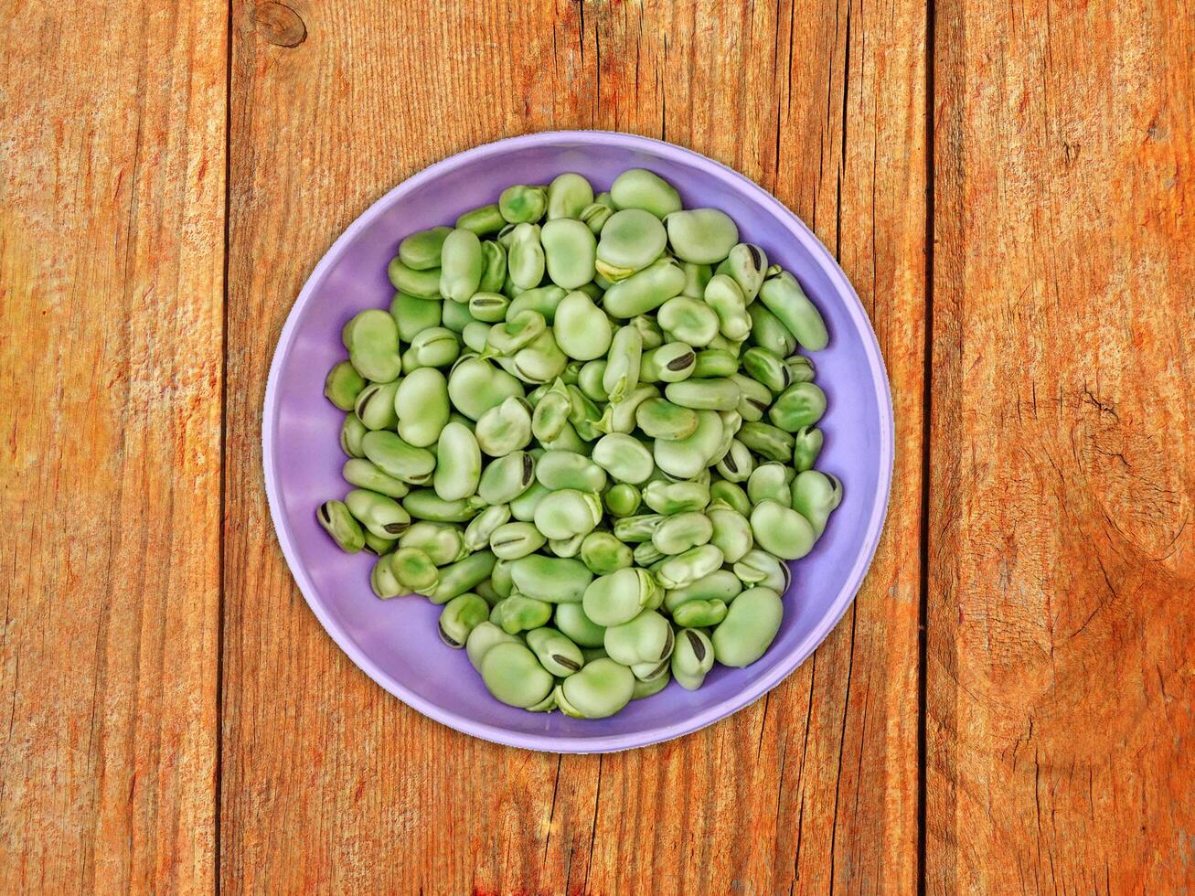 Broad Beans On Wooden Background photo