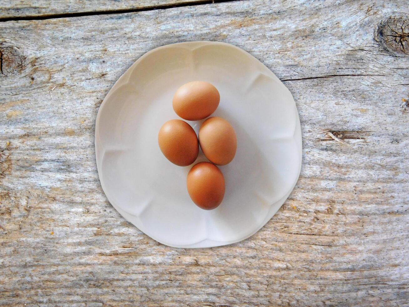 Eggs On The Wooden Background photo