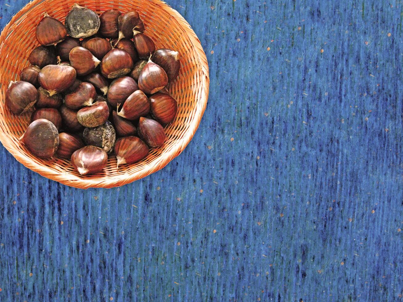 Chestnuts On The Wooden Background photo