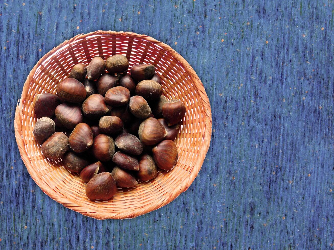 Chestnuts On The Wooden Background photo