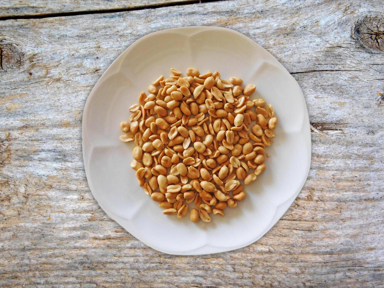 Peanuts On Wooden Background photo