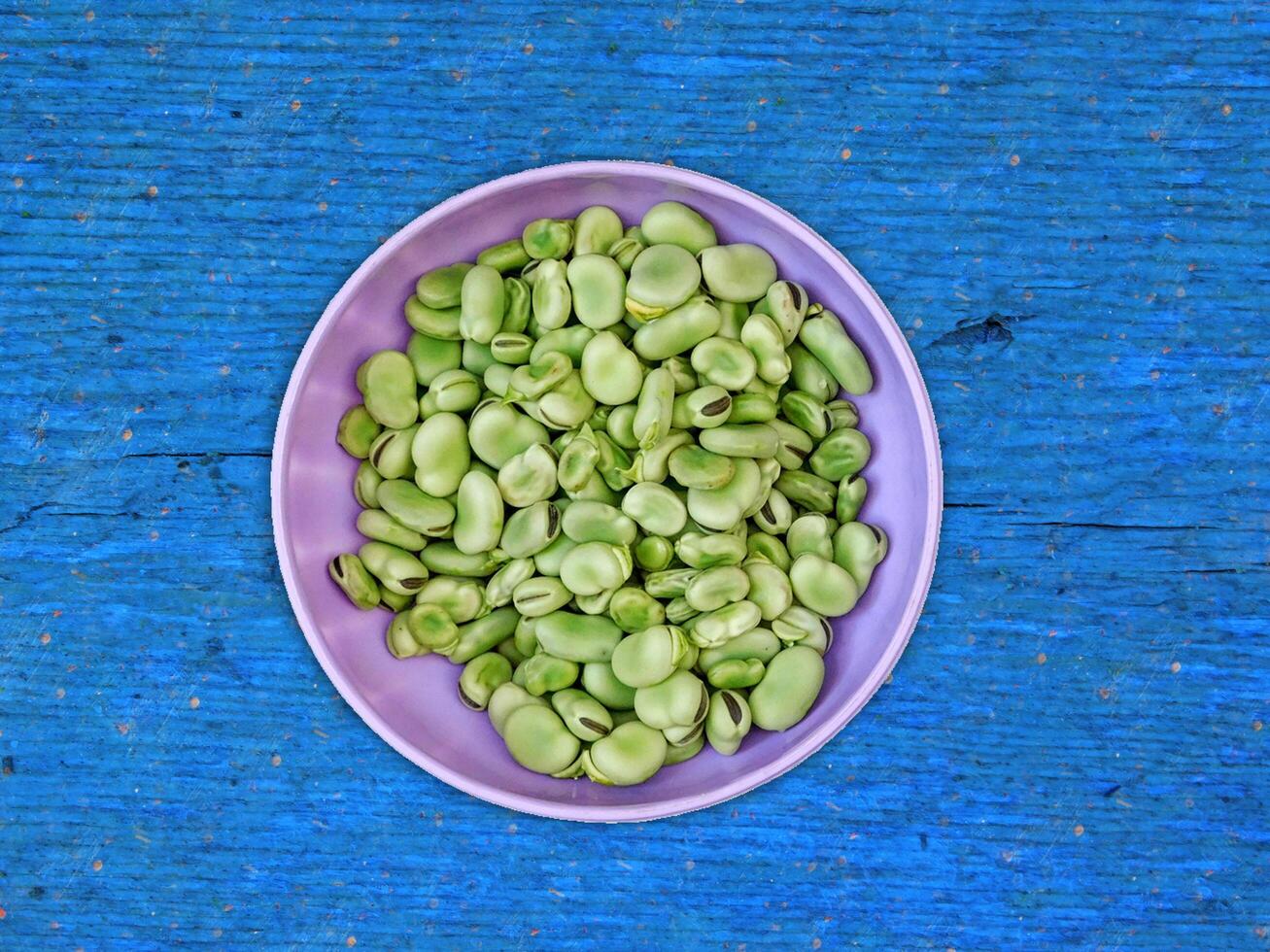 Broad Beans On Wooden Background photo