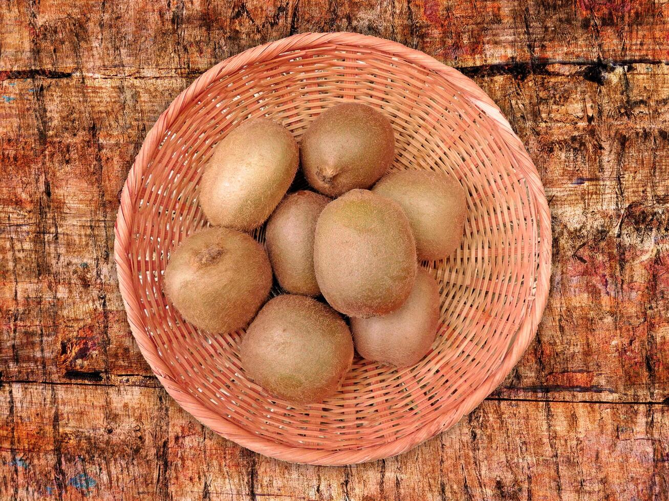 Kiwi On Wooden Background photo