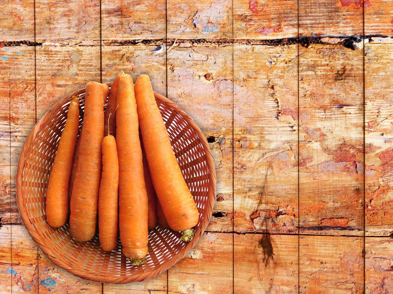 Carrots On The Wooden Background photo