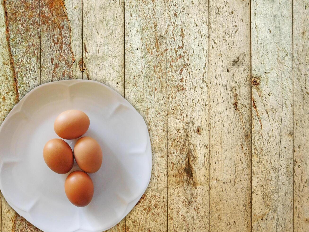 Eggs On The Wooden Background photo