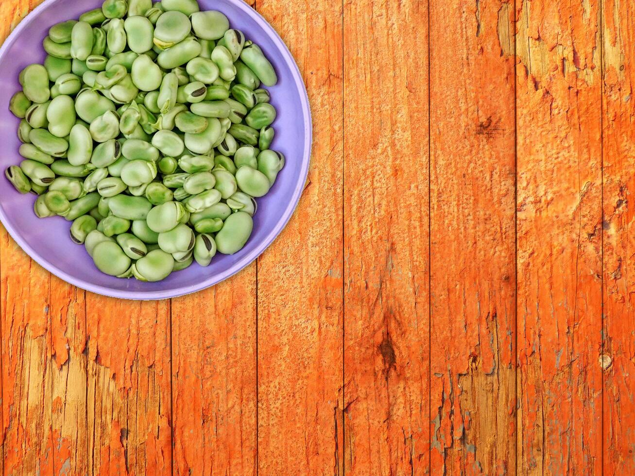 Broad Beans On Wooden Background photo