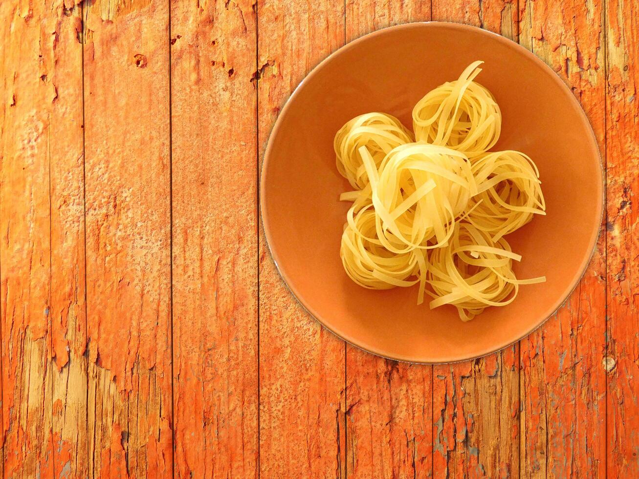 Pasta On Wooden Background photo