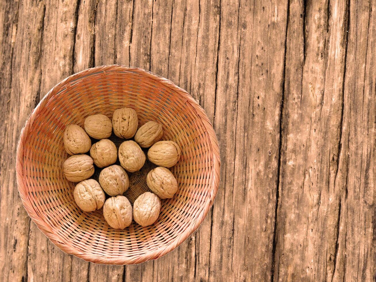 Nuts On The Wooden Background photo