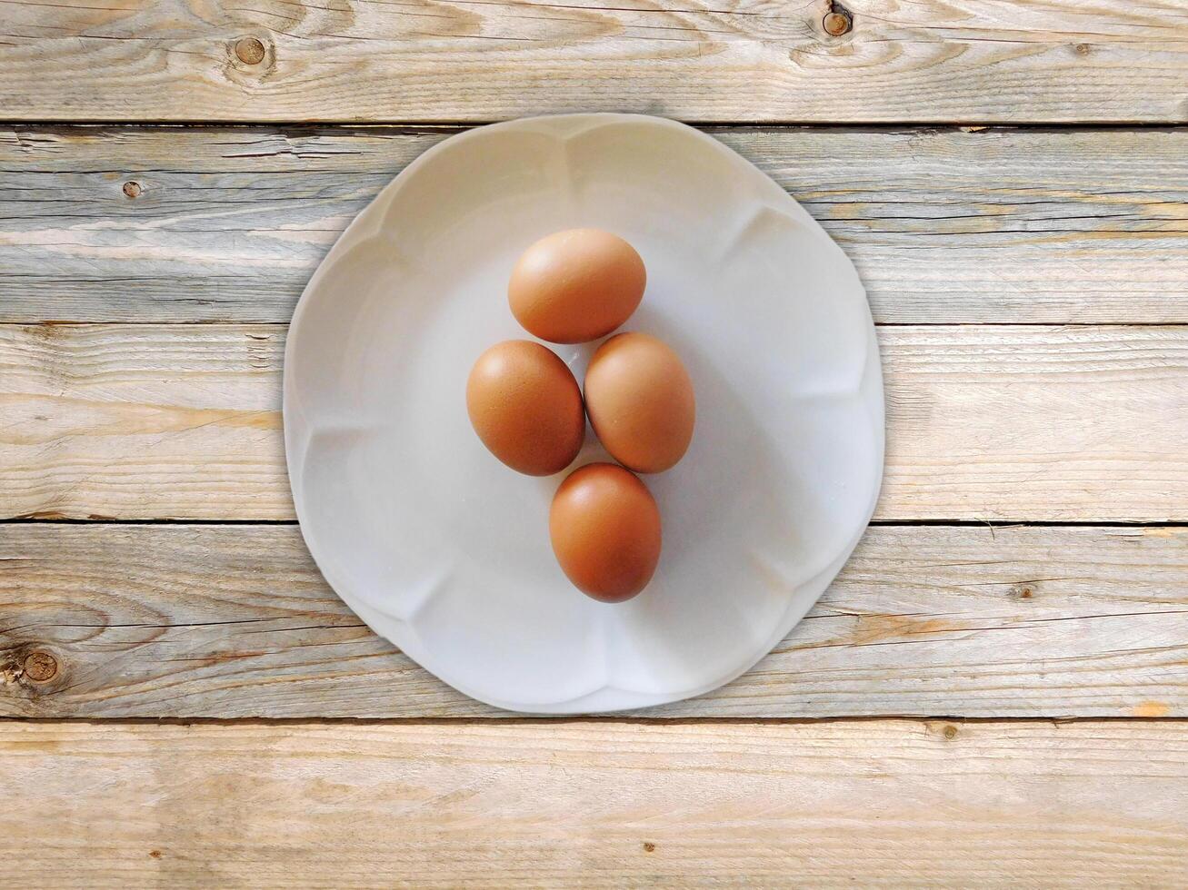 Eggs On The Wooden Background photo