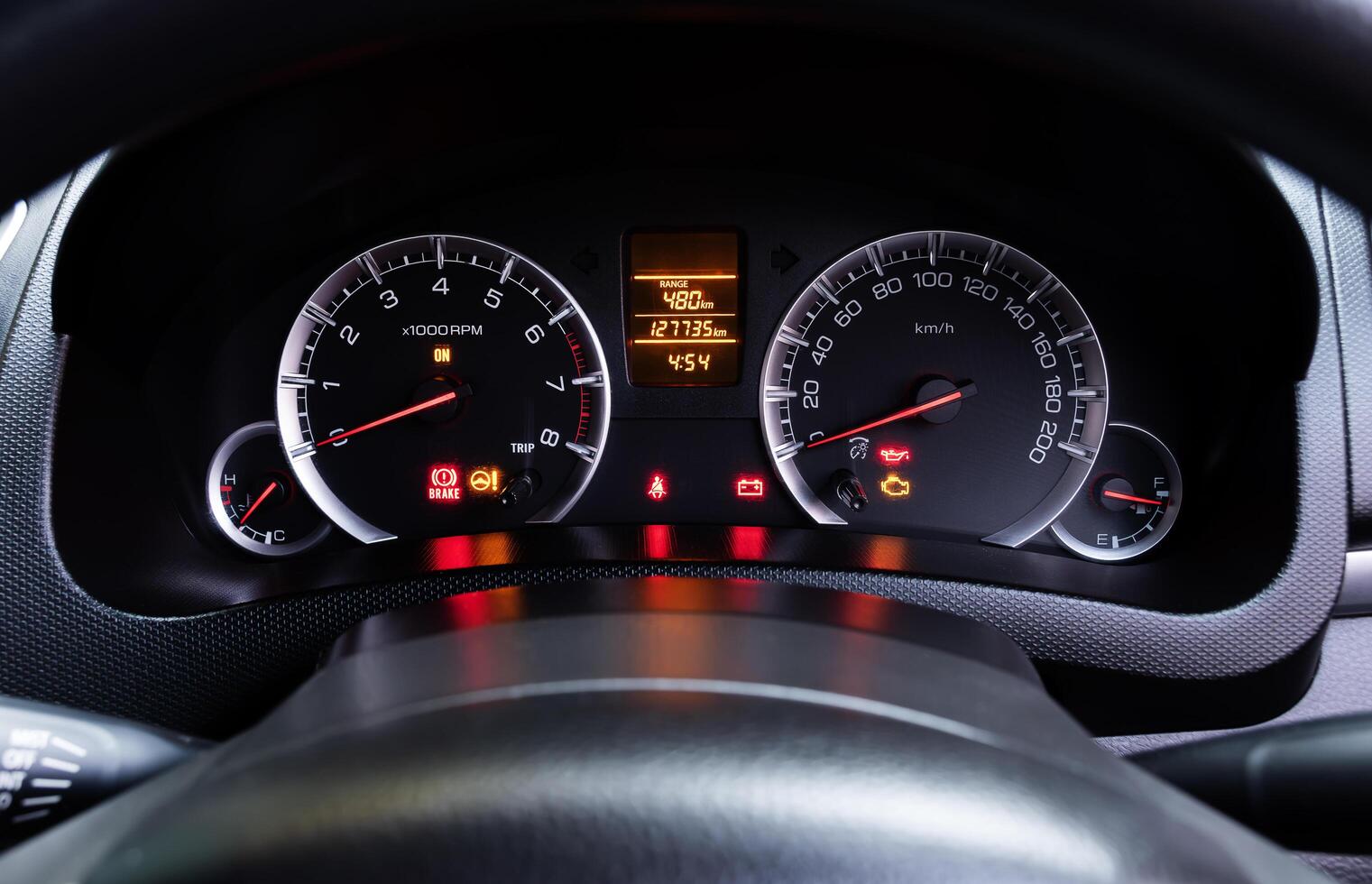 Analog dashboard car with colorful light status symbol photo
