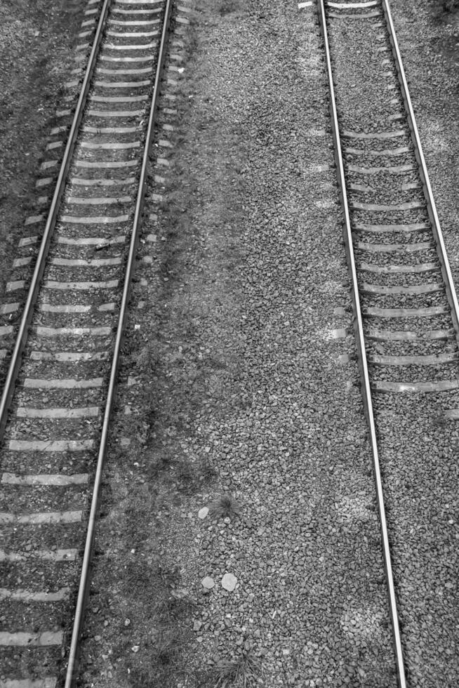 Photography to theme railway track after passing train on railroad photo