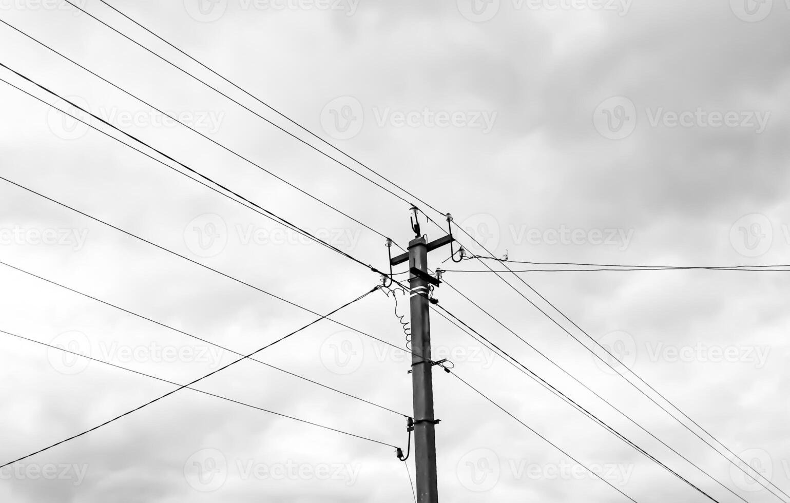 Power electric pole with line wire on light background close up photo