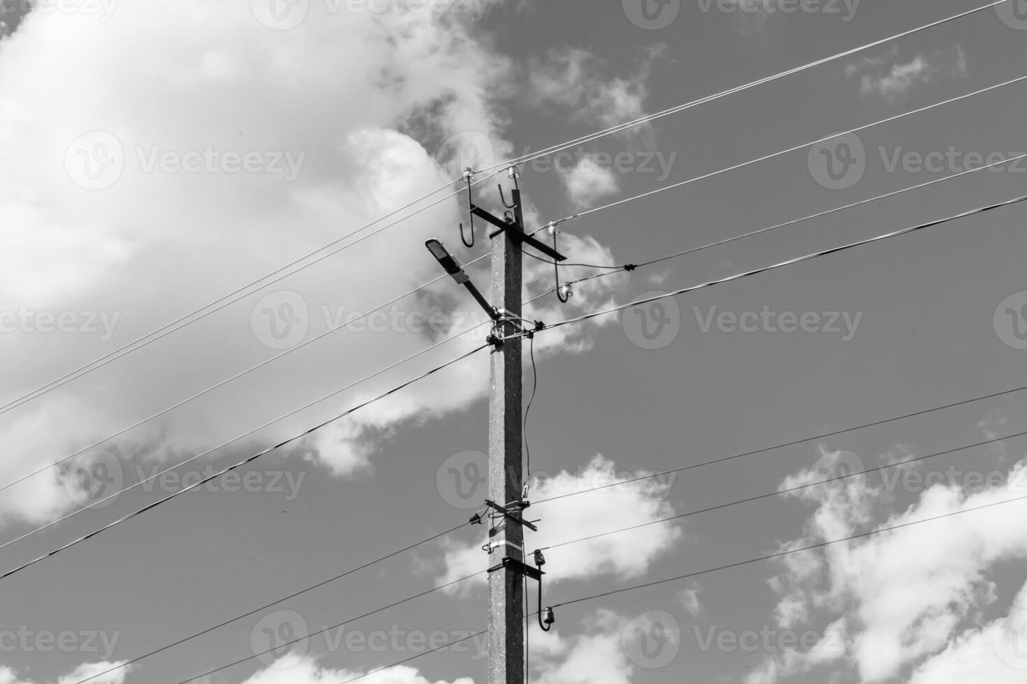 Power electric pole with line wire on light background close up photo