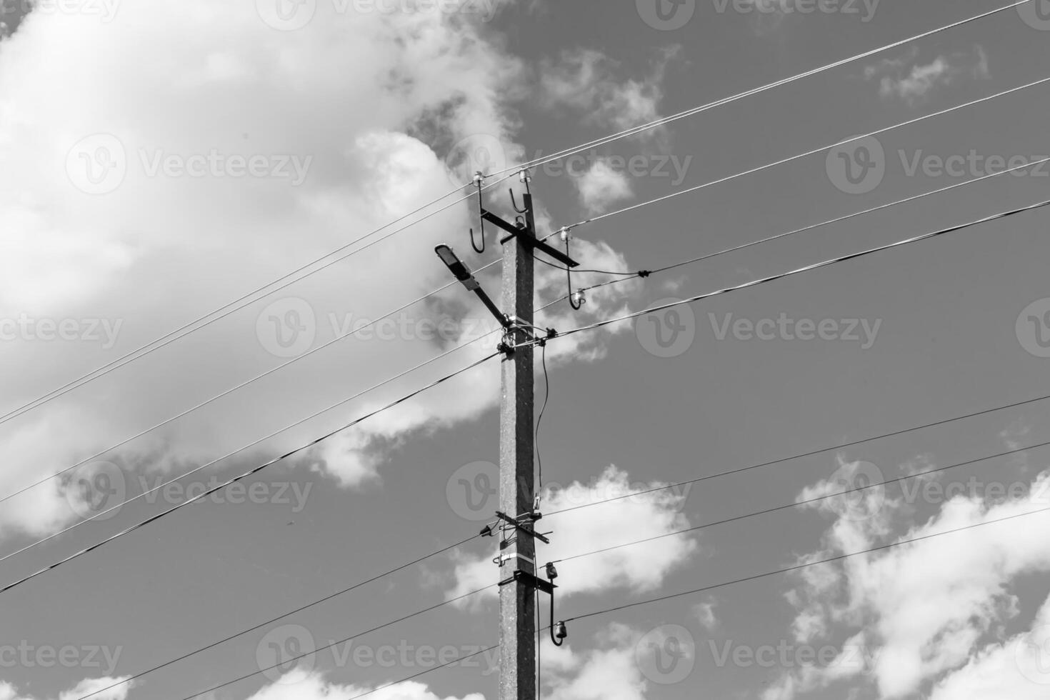 Power electric pole with line wire on light background close up photo