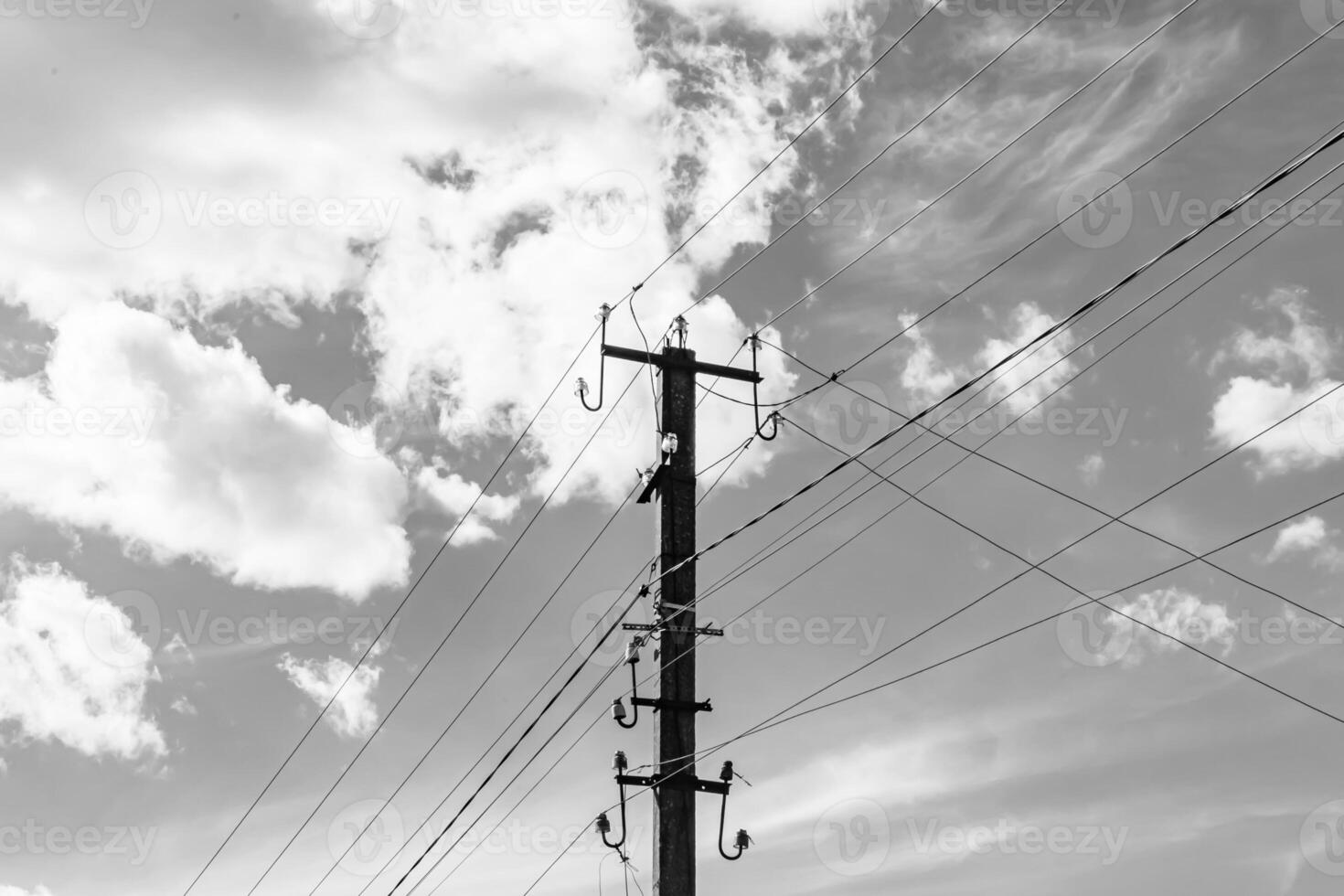 Power electric pole with line wire on light background close up photo