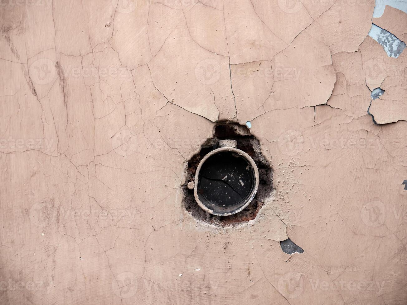 a hole in the wall used to install an electrical outlet photo