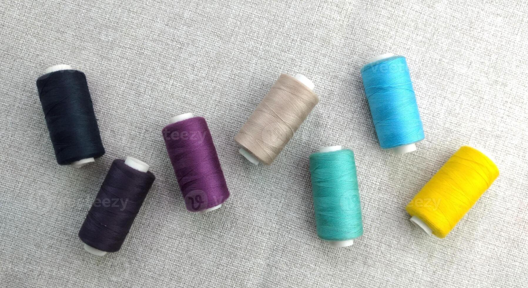 Rolls of multi-colored threads for tailors working in the garment embroidery sector photo