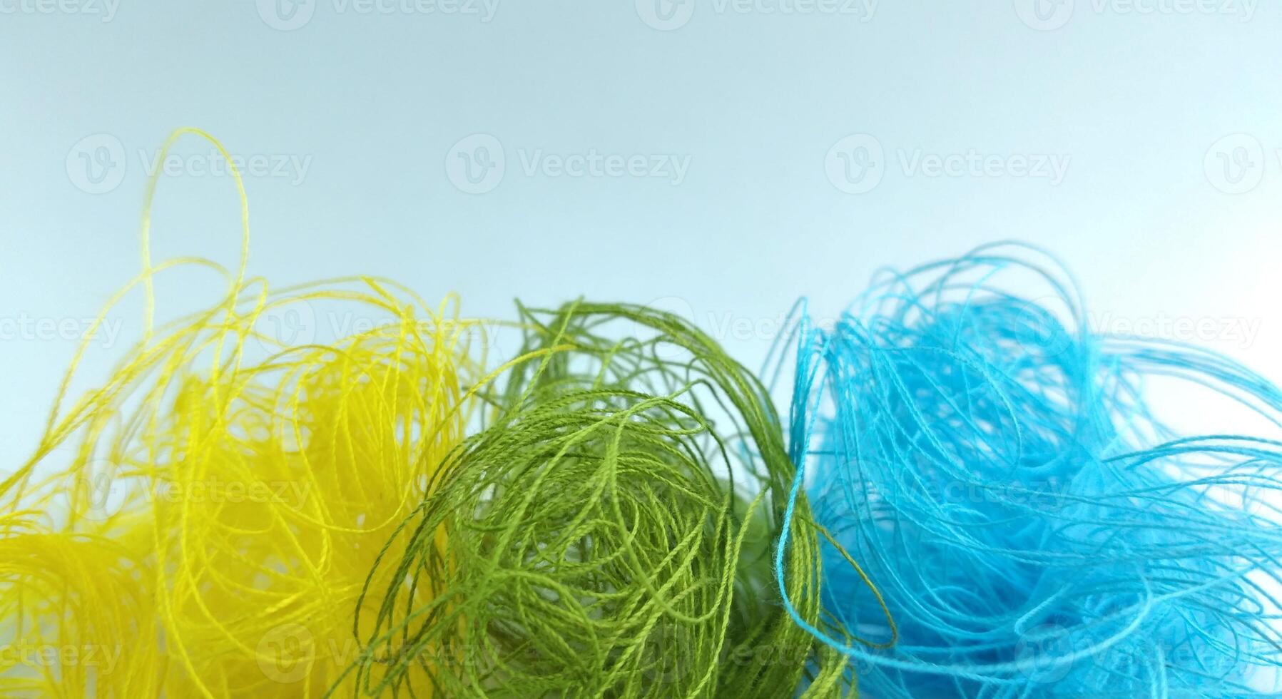 Colorful threads on a white background close-up. Selective focus. photo