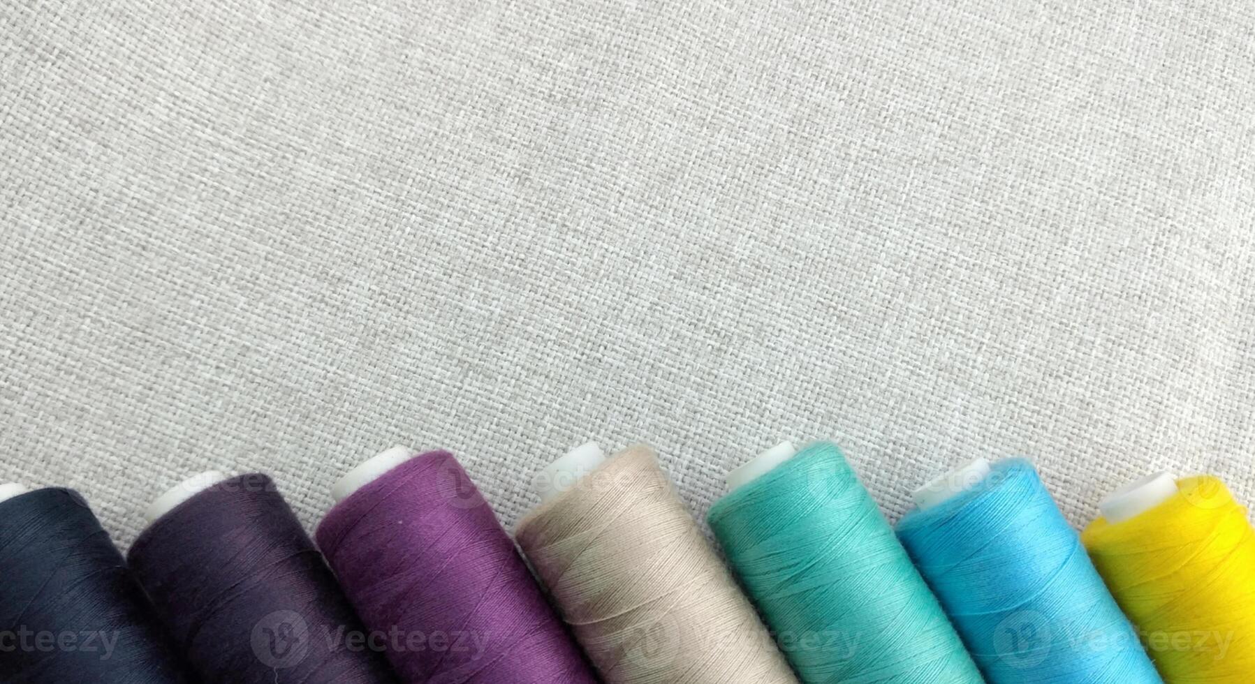 Rolls of multi-colored threads for tailors working in the garment embroidery sector photo