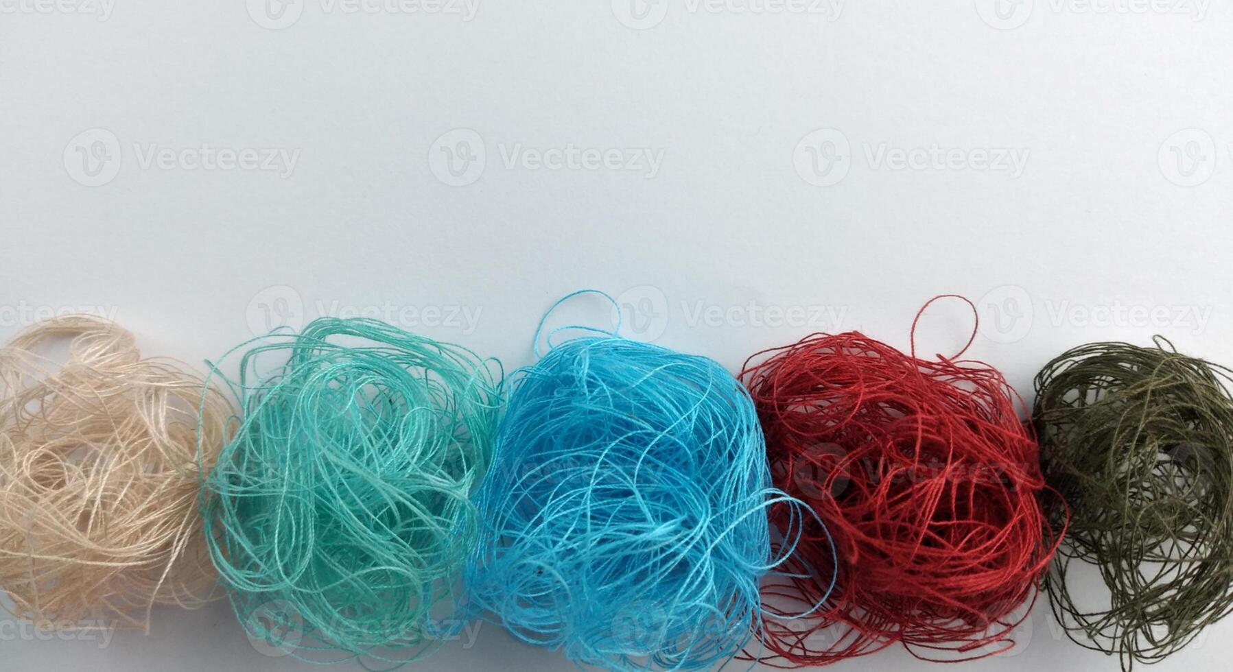 Colorful threads on a white background close-up. Selective focus. photo