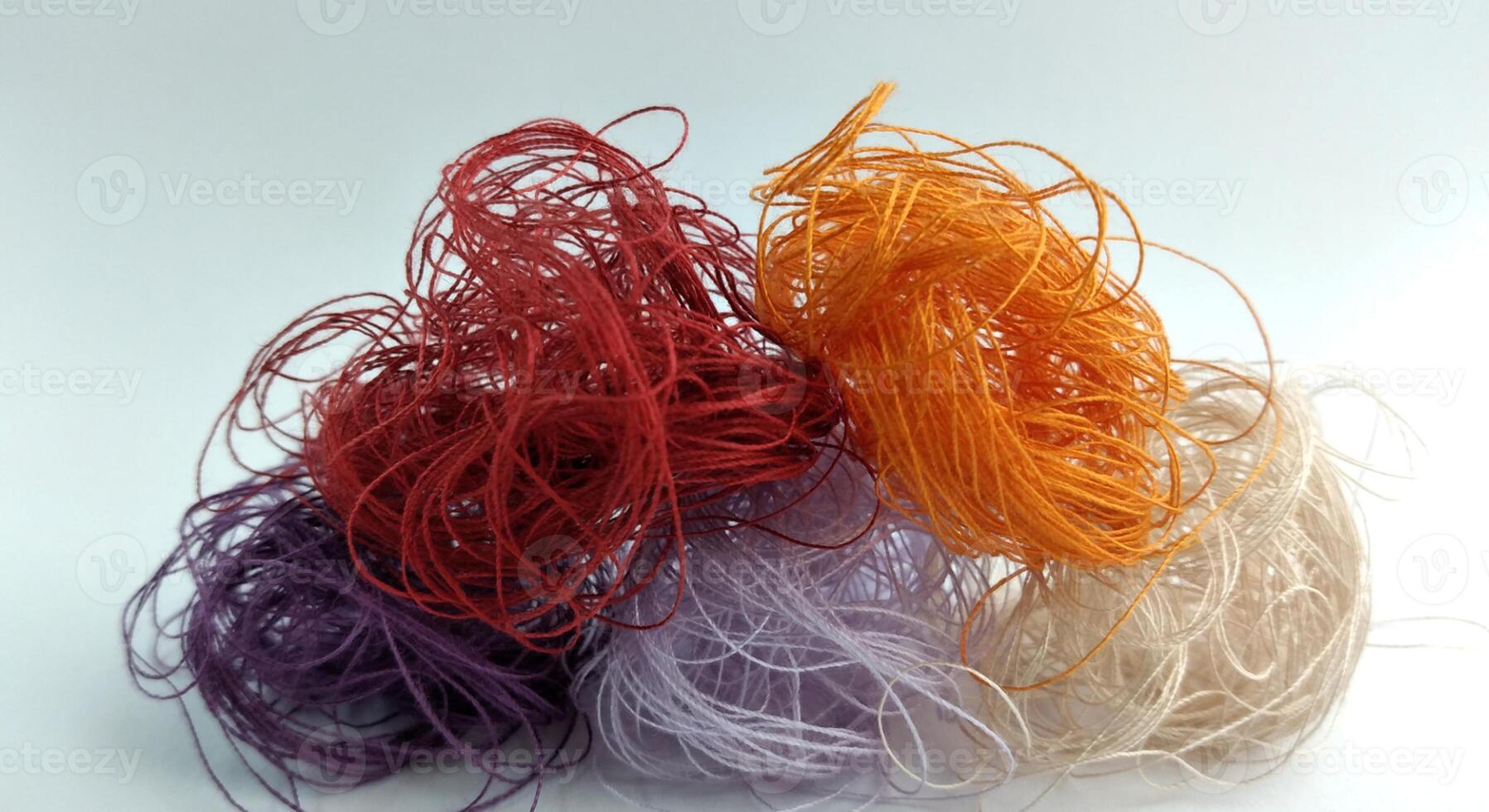 Colorful threads on a white background close-up. Selective focus. photo