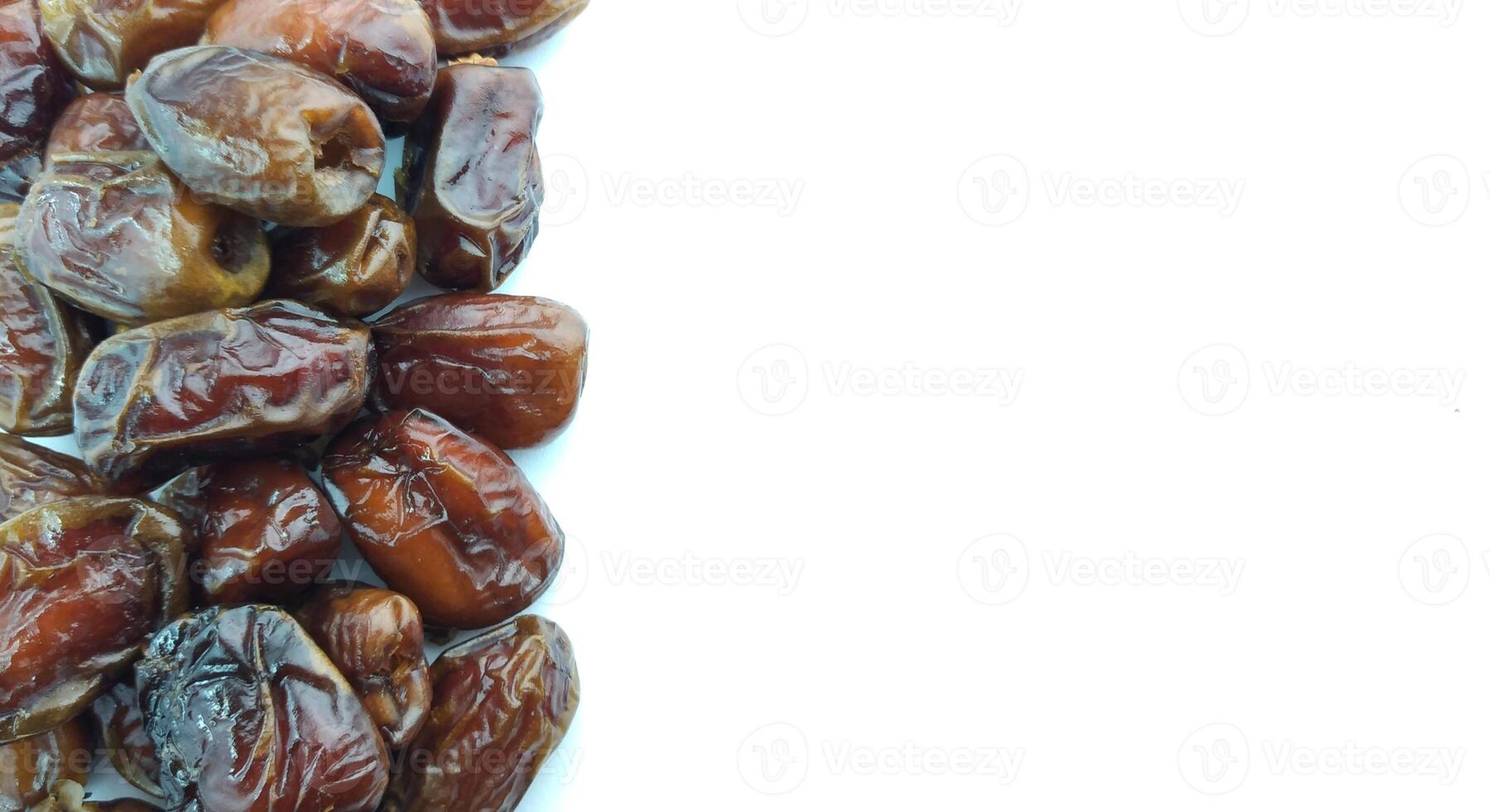 Dates fruit isolated on white background. Close up. Selective focus. photo