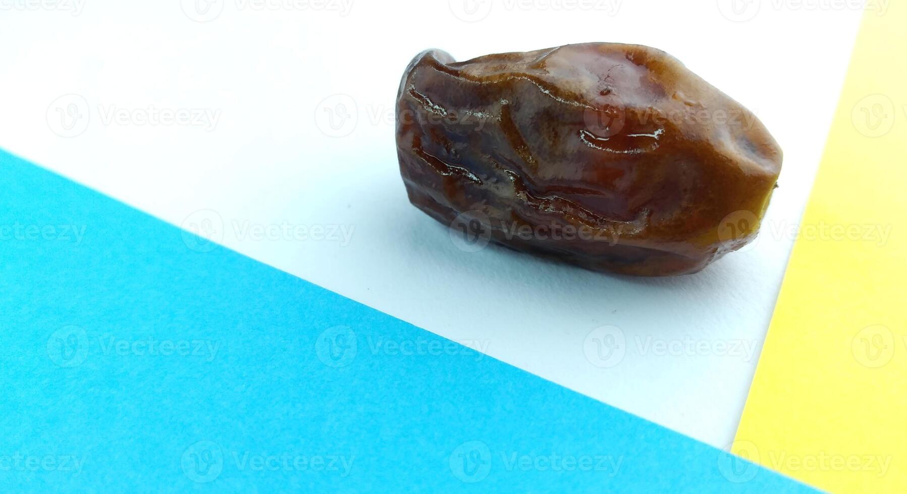 Dates on a blue background. Close-up. Food background. photo