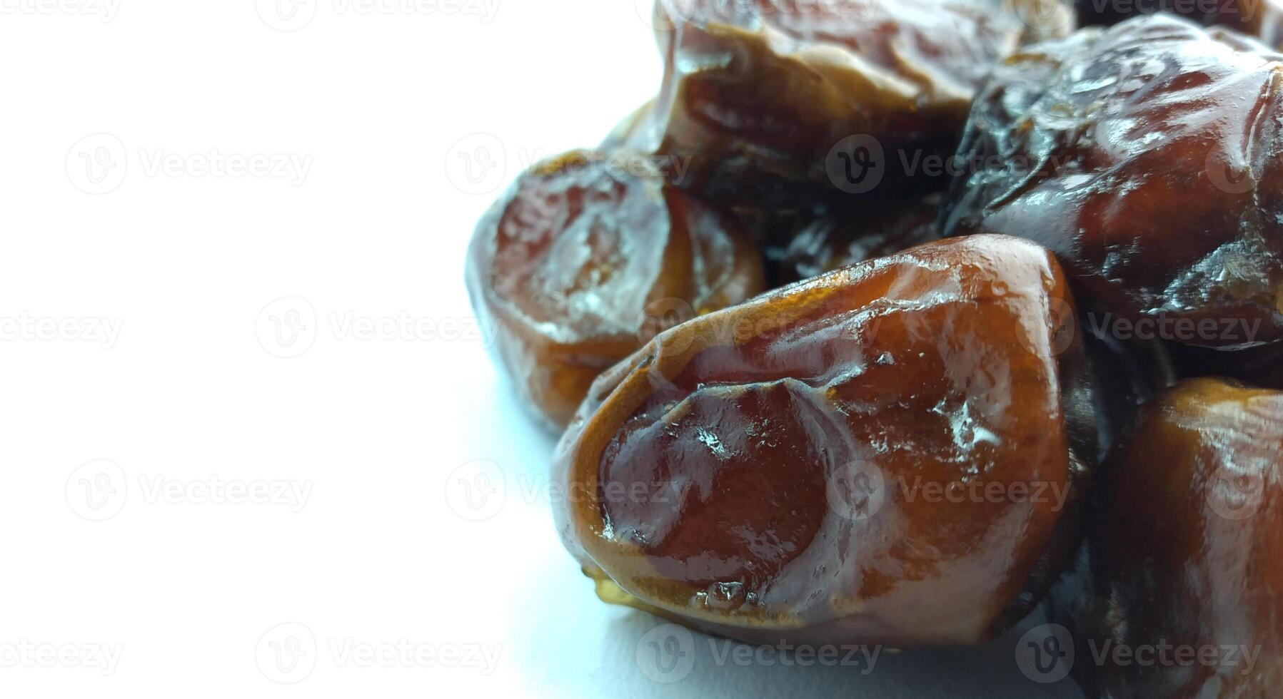 Dates fruit isolated on white background. Close up. Selective focus. photo