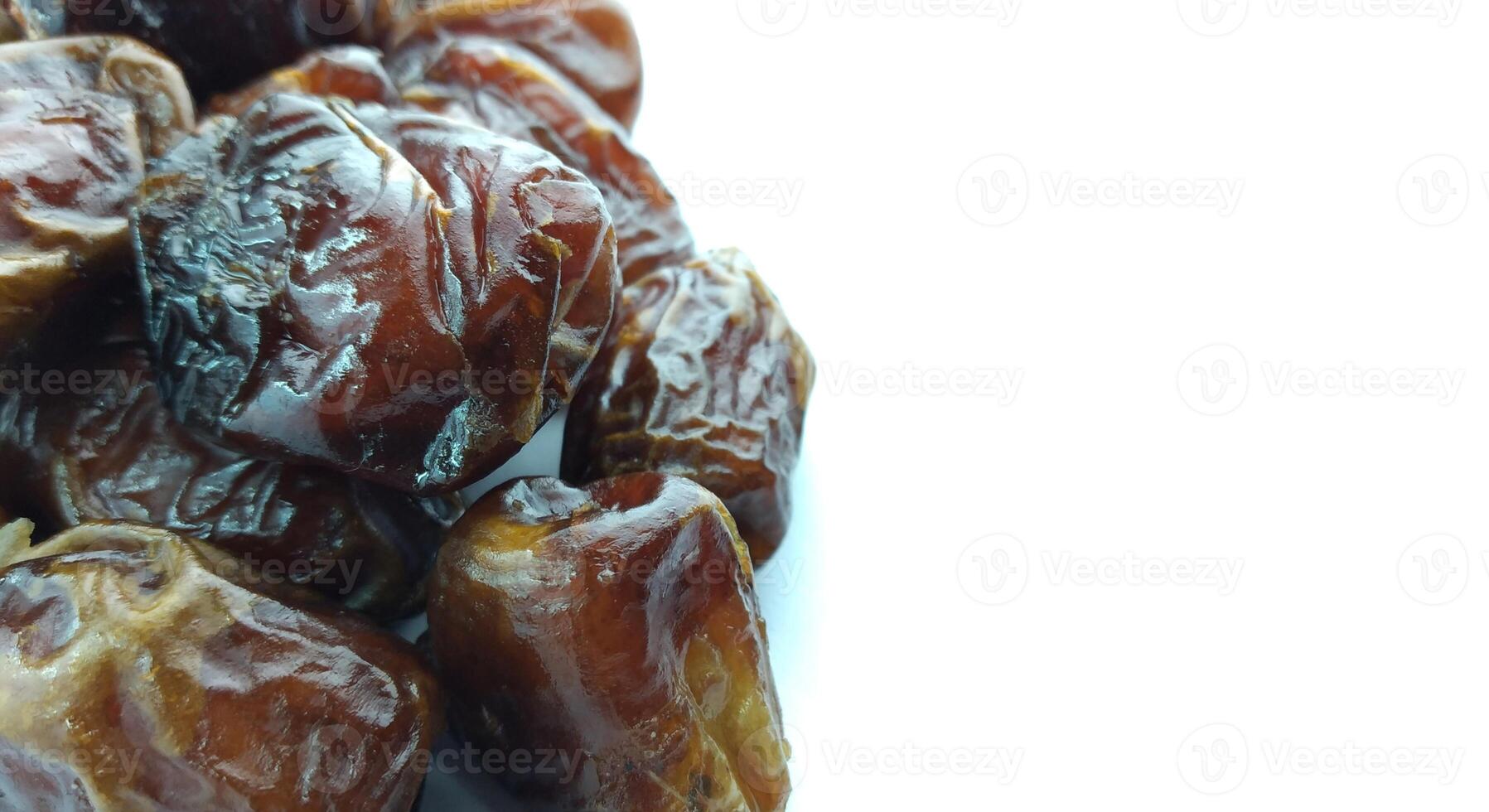 Dates fruit isolated on white background. Close up. Selective focus. photo