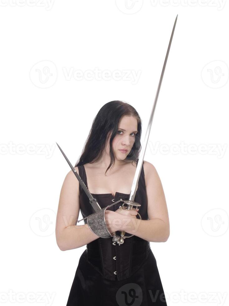 Young woman with sword and dagger in corset and skirt photo