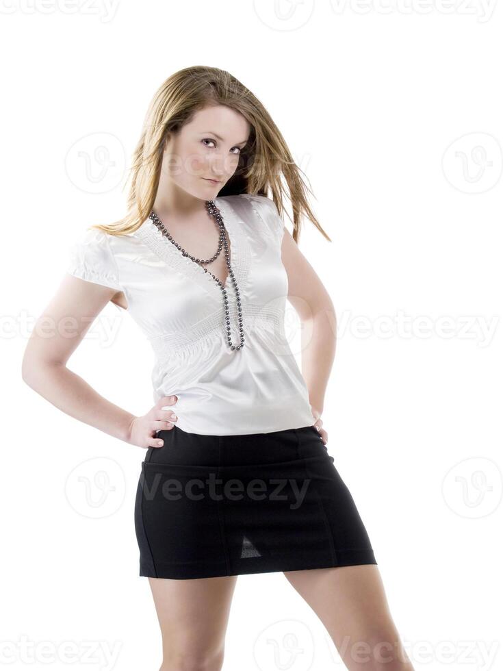 Young woman in white blouse and black skirt photo