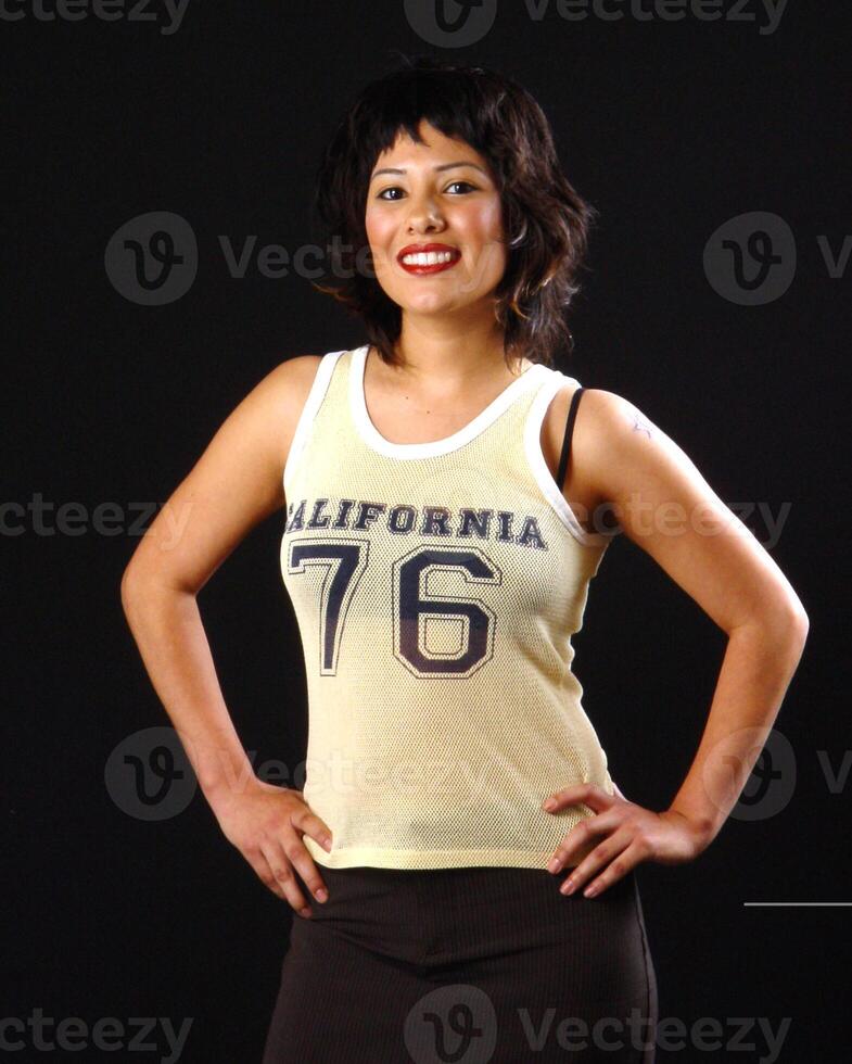 Young Latina Woman Smiling Short Yellow Top photo