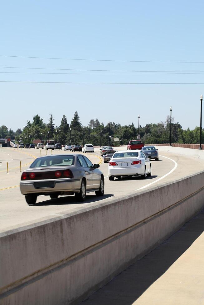 Folsom, CA, 2010 - Auto traffic rounding curve in the road photo