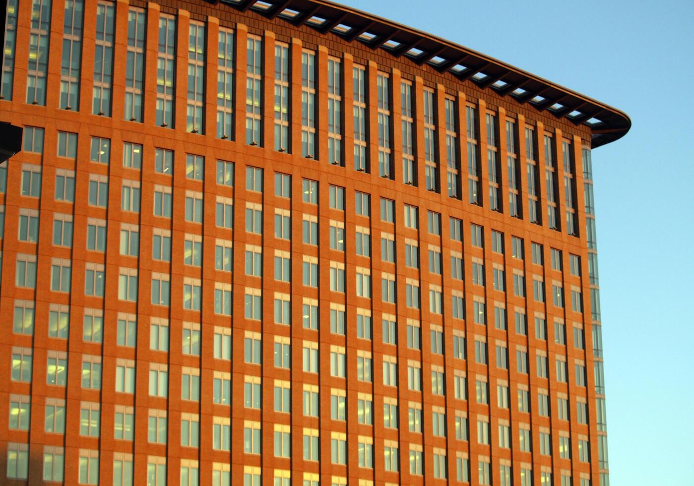 Boston, MA, 2008 - red building with lots of windows in blue sky photo