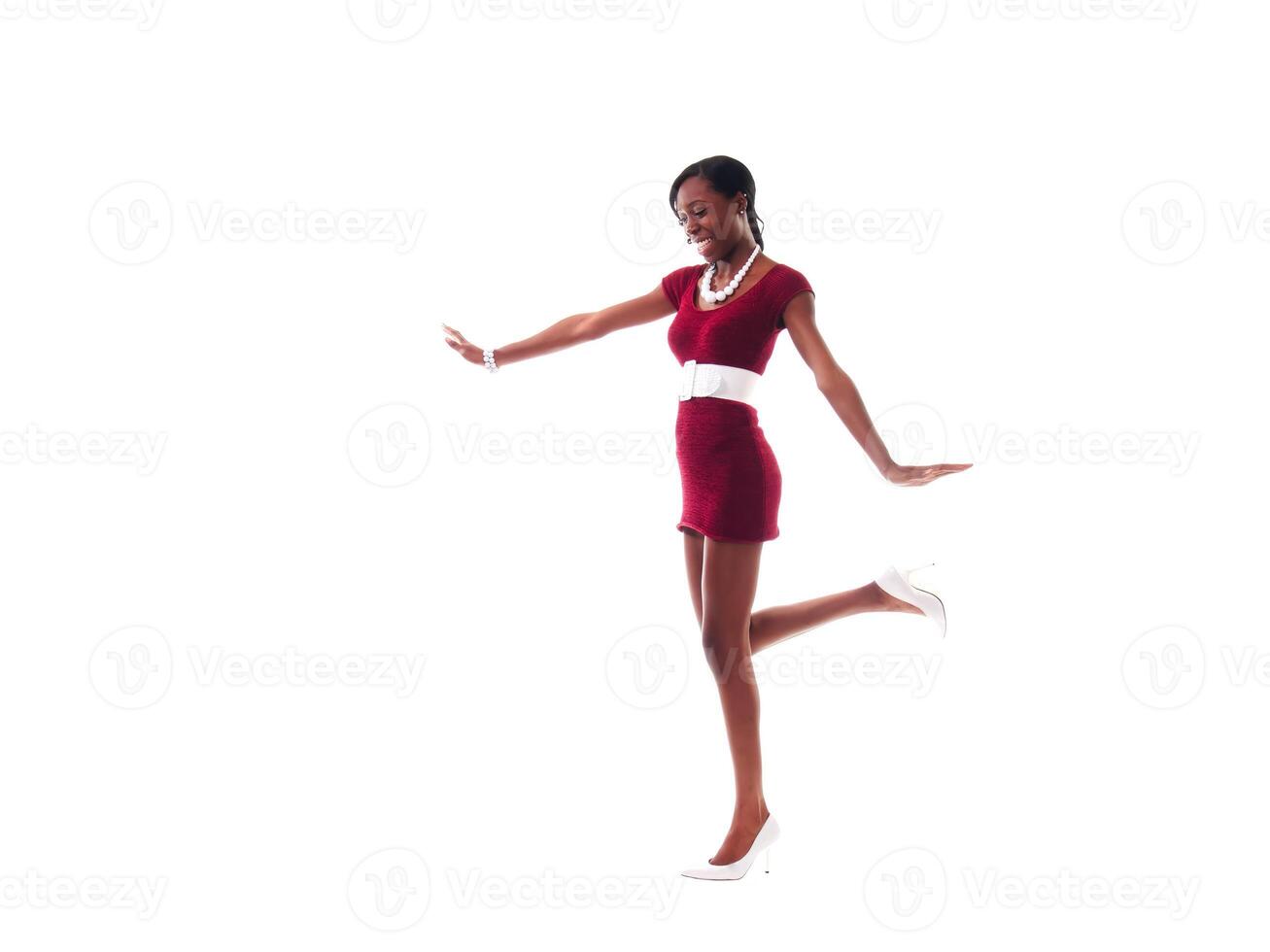 Slim African American Woman Standing In Red Dress On White photo