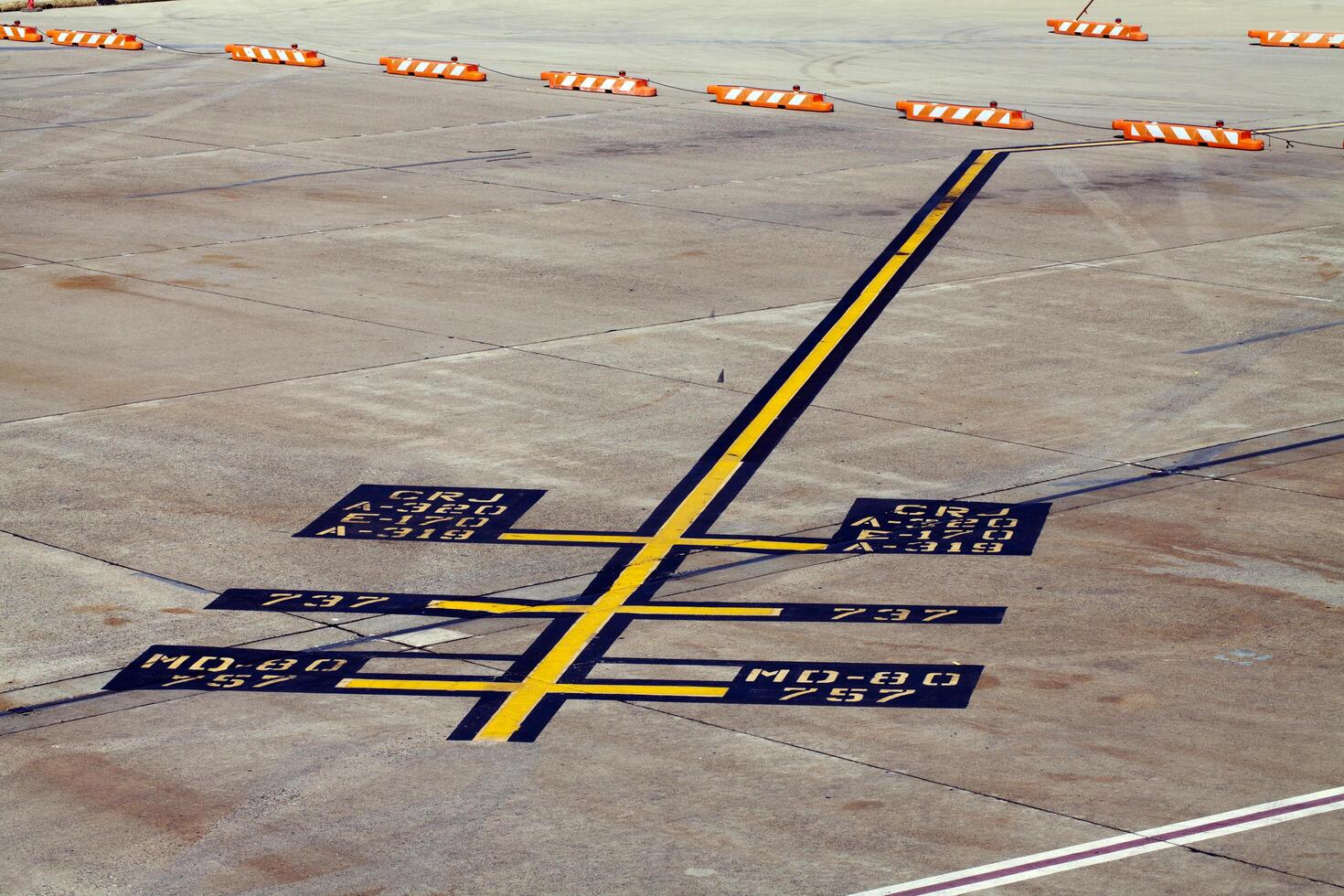 Sacramento, CA, 2011 - Airplane parking markings on airport tarmac yellow blue photo
