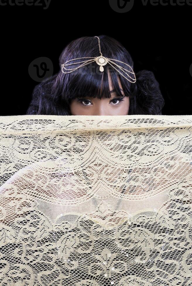 Attractive African American Woman Eyes Above Gold Cloth photo