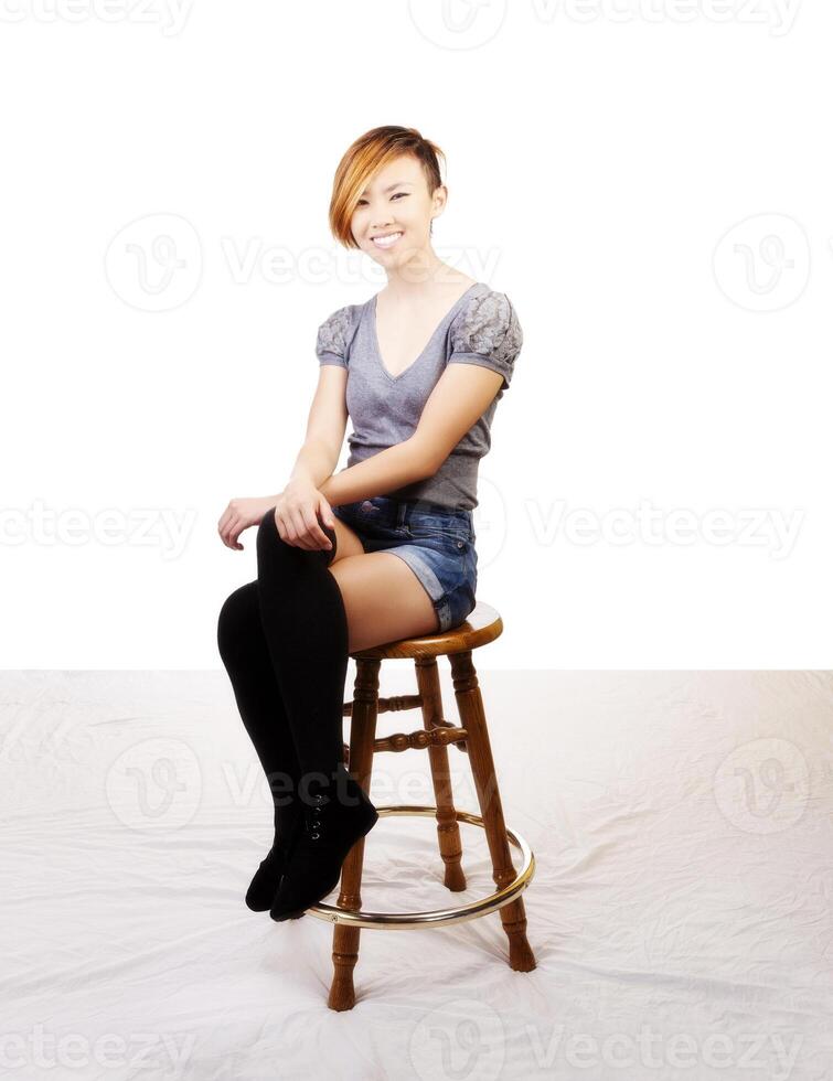 Smiling Skinny Attractive Asian American Woman Sitting photo
