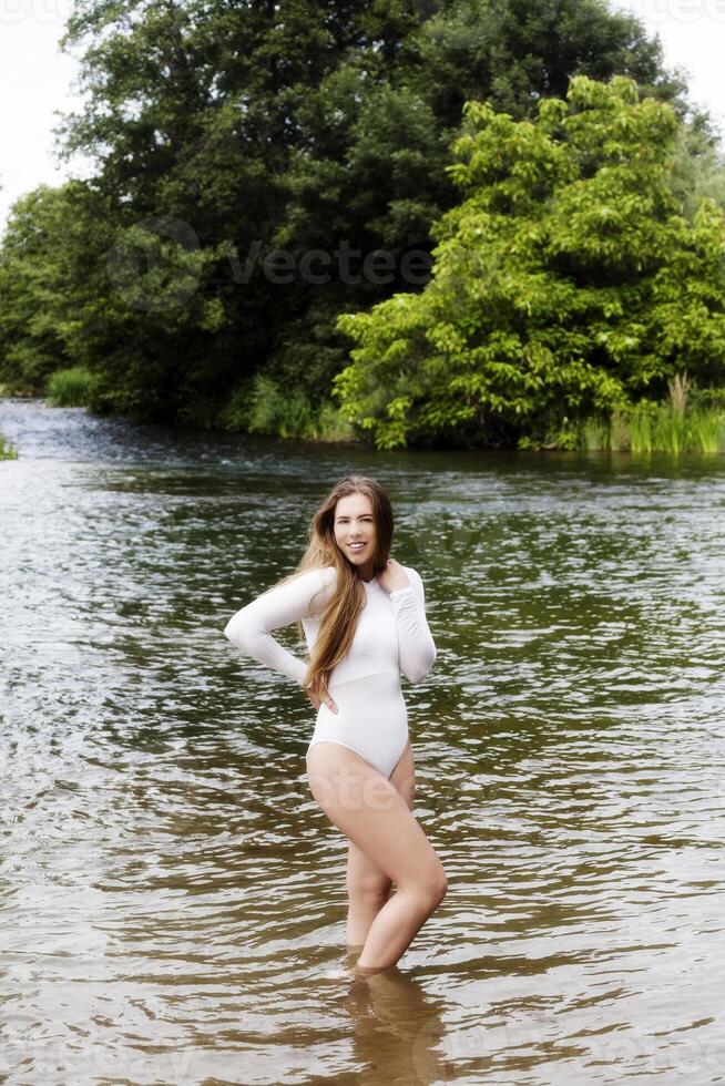 Teen Caucasian Woman Outdoor Standing In River photo