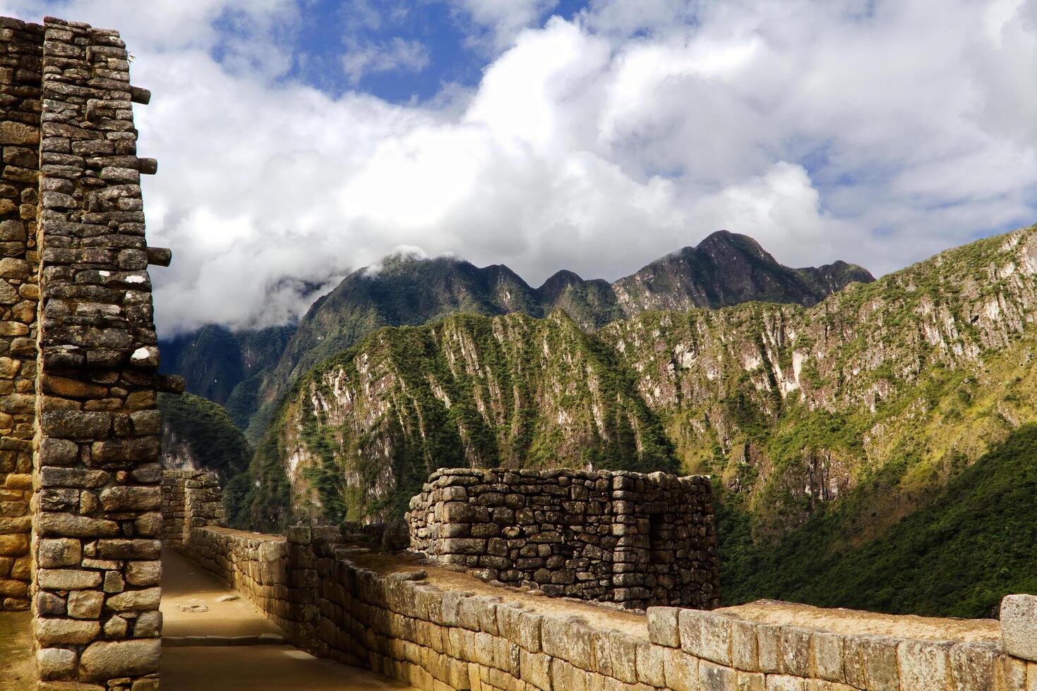 Machu Picchu, Peru, 2015 - Inca Stone Walls With Mountains And Clouds South America photo