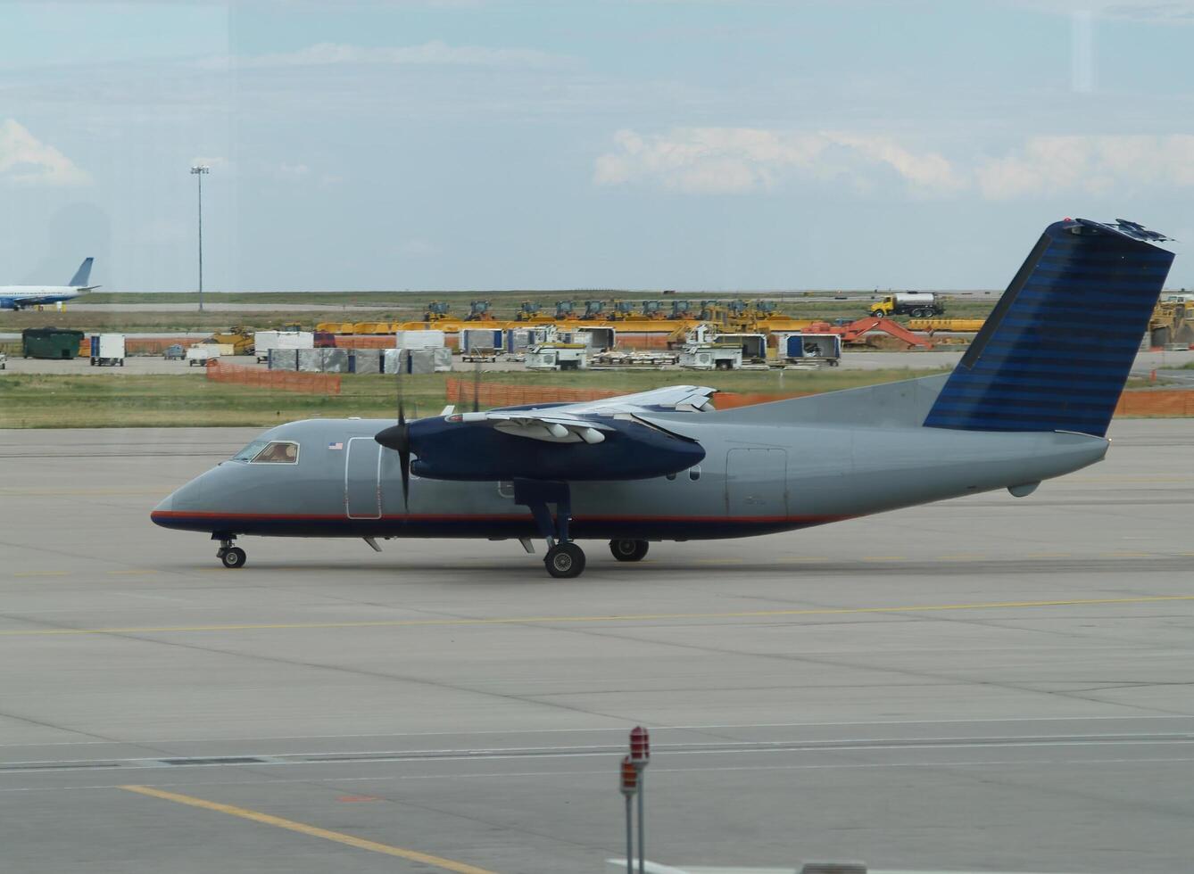 Boston, MA, 2008 - Two-Propeller Commercial Aircraft Heading Out For Takeoff photo
