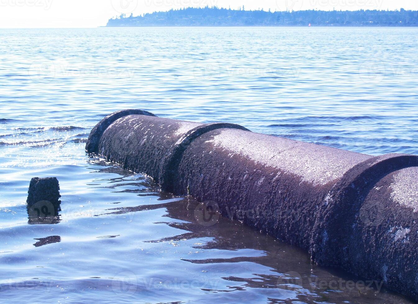 Outlet Drainage Pipe Running Into Lake photo