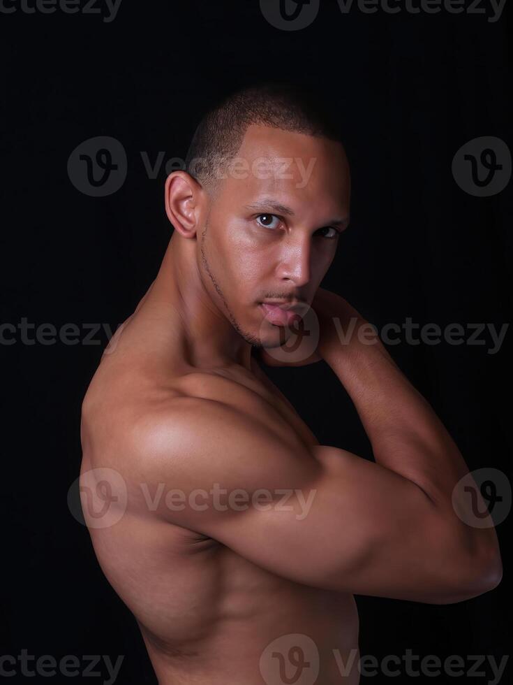 Shirtless African American Man Showing Toned Body photo